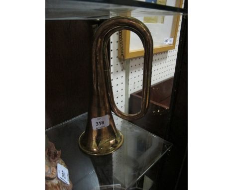 A COPPER AND BRASS BUGLE inscribed "Class A Boosey & Company London"