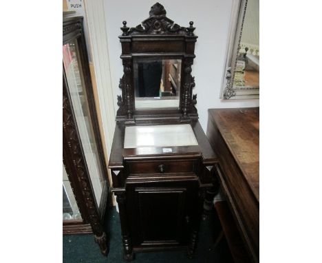 A CONTINENTAL MAHOGANY DRESSING STAND of inverted breakfront outline the super structure with carved cresting above a rectang