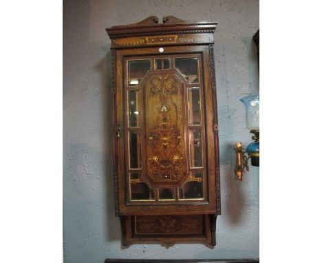 A FINE PAIR OF ITALIAN MARQUETRY DISPLAY CABINETS c.1880 the bevelled glass door with central raised marquetry panel and carv