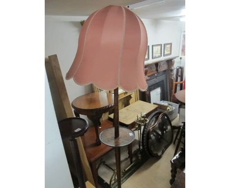 AN OAK TWO TIER STANDARD LAMP with circular tray together with a mahogany torchere 