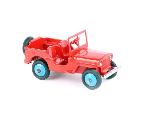 A rare Dinky Toys Jeep 25J 1947-1948. In red with mid blue wheels and black tyres, with screen, open steering wheel and spare