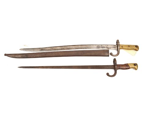 A Chassepot bayonet, marked St Etienne, 1869 on backstrap, in scabbard, and a Gras bayonet (blade some rust), no scabbard. Ge