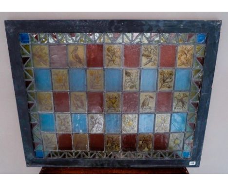 LEADED LIGHT PANE MADE UP OF 45 GLASS PANELS, some depicting wildlife and distressed gilt picture frame. 72cm x 91cm 