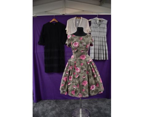 Three vintage 1950s dresses and a blouse, two cotton dresses, one having pink flowers on a grey background, full skirt with p