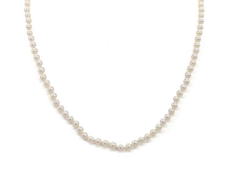A single row cultured pearl necklace, with slightly off-round cultured pearls, untested, 4.00 to 4.50mm, strung knotted to a 