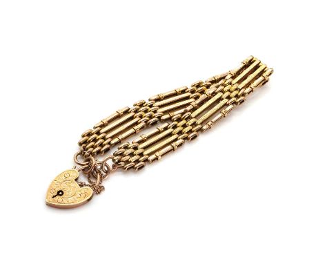 An Edwardian gate bracelet, with four rows of alternating brick and gate links, the central rows with a textured finish, to a