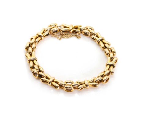 A two row gate bracelet,  with curved gate links alternating to oval brick links, to a concealed box clasp and safety chain, 