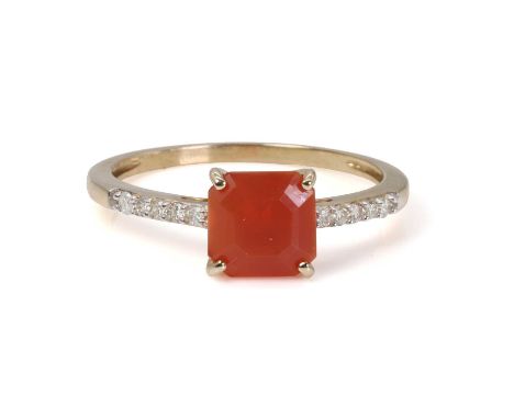 A fire opal and diamond ring,  with a square cut fire opal, four claw set, to shoulders each set with a line round brilliant 
