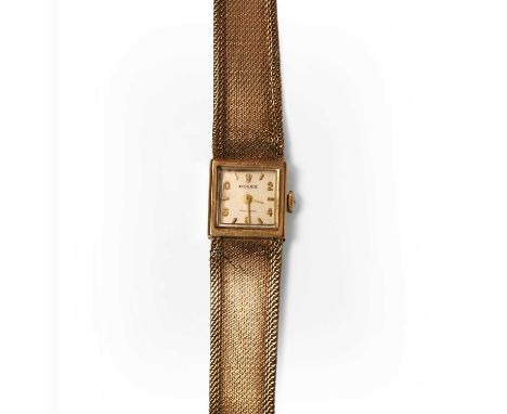 A ladies' 9ct gold Rolex mechanical bracelet watch, c.1960,  with a 15.20mm square case. A silvered dial with raised gilt bat