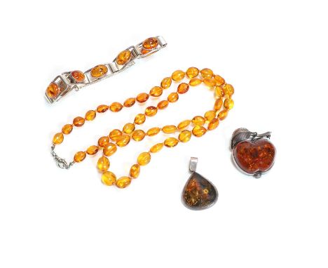 A group of amber jewellery, comprising a silver clarified amber link bracelet, approximately 180mm long, stamped 925, a clari