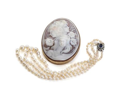 A 9ct gold large shell cameo brooch and a cultured pearl necklace, an oval shell cameo depicting ladies surrounded by flowers