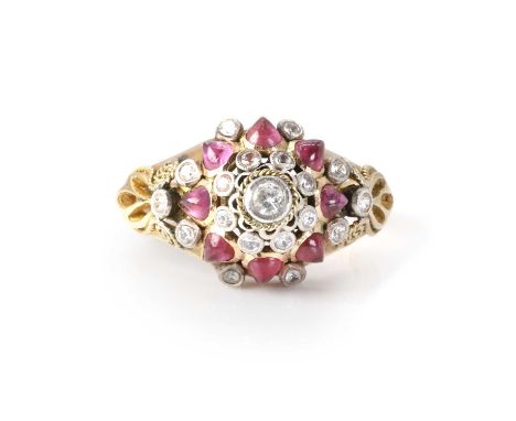 A ruby and colourless sapphire Thai princess ring,  set with cabochon pear shaped rubies and round mixed cut colourless sapph