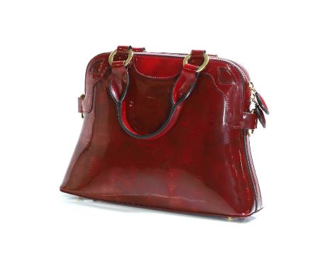 A Cartier burgundy 'Happy Birthday' bag, the exterior in burgundy monogrammed patent leather, with gold tone hardware, two to