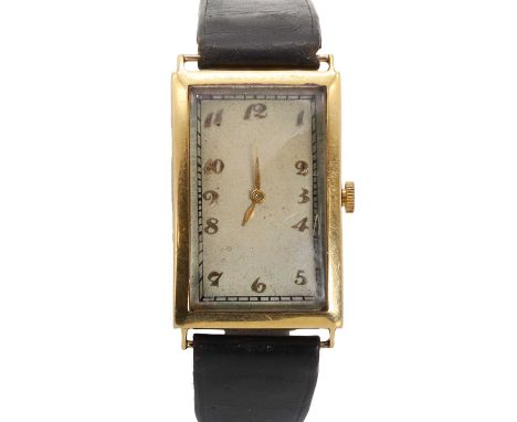 An 18ct gold Longines mechanical strap watch, with a rectangular case, 32 x 25mm, a silvered dial, applied gilt Arabic number