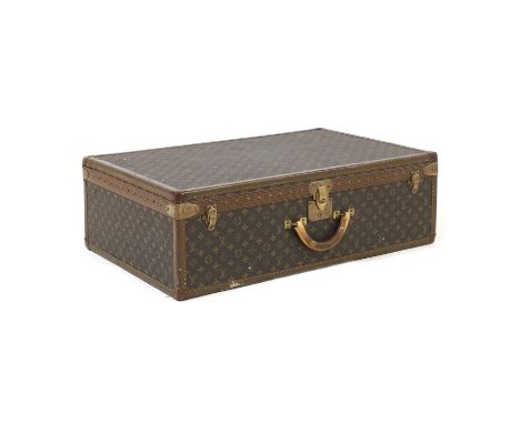 A Louis Vuitton monogrammed canvas 'Alzer 80' suitcase, with brass-tone hardware, a leather handle to the top, central lock a