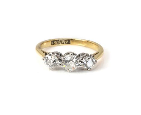 A diamond three stone ring,  with three graduated old European cut diamonds, the principal stone estimated as 0.40ct, claw se