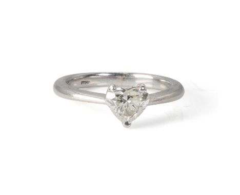 A platinum single stone heart shaped diamond ring,  with a heart shaped diamond weighing 0.82ct, claw set to a plain platinum