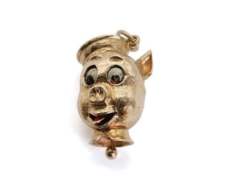 A novelty 9ct gold pig head charm,  with articulated eyes and tongue. Enamel decoration with a pull activated movement, Londo