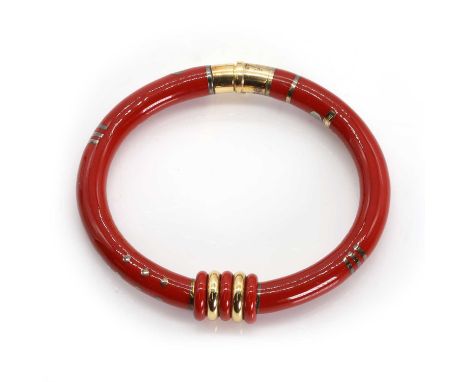 An 18ct gold, silver and enamel bangle, by La Nouvelle Bague, composed of two hinged sections, decorated with red enamel, wit