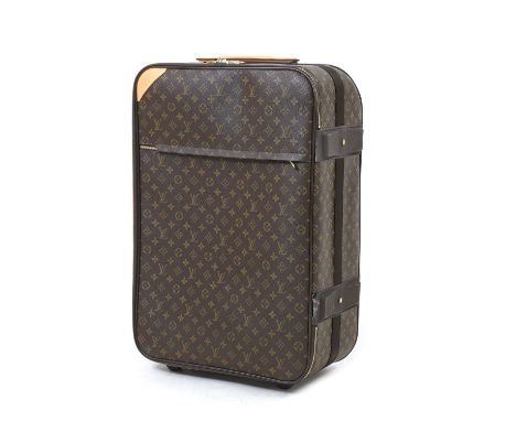 A Louis Vuitton monogrammed canvas Pegase 65, brass tone hardware, leather top and side handle, zip front pocket and zip arou