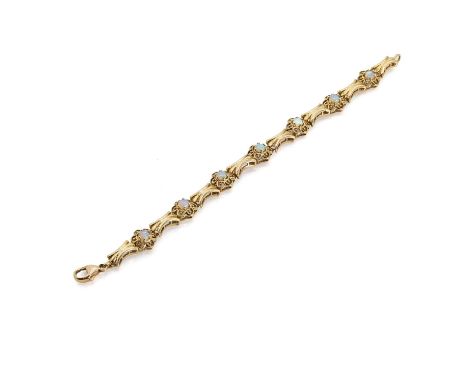 An opal floral link bracelet, with open floral links each claw set with a round opal cabochon, alternating between fluted lin