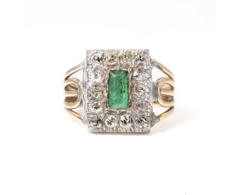 A Georgian emerald and diamond mourning cluster, with a foiled faceted emerald in cut down setting, to a surround of old cut 