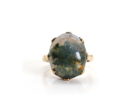 A 9ct gold single stone moss agate ring,  an oval cabochon moss agate claw set to a scalloped gallery, to solid shoulders and