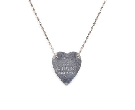 A Gucci heart pendant, the flat heart pendant engraved ® GUCCI made in Italy, 19mm x 16mm, to an adjustable trace link back c