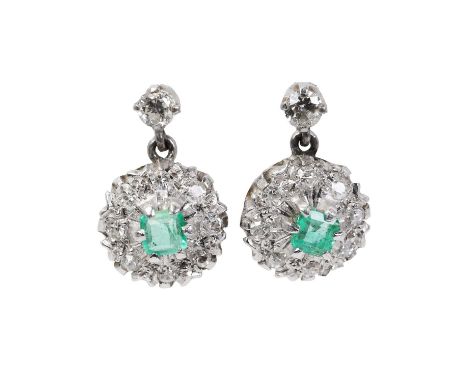 A pair of white gold Emerald and diamond drop stud earrings, each with a circular drop set with a central step cut emerald, w