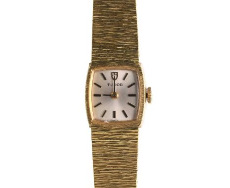 A ladies' gilt metal Tudor mechanical bracelet watch,  with a cushion shaped case, 15mm x 22mm, a silvered dial, black and gi