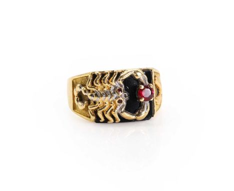 An onyx and ruby set scorpion ring,  with a round cut ruby, claw set and held between to pincers of a scorpion in relief, upo