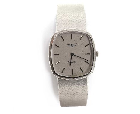 An 18ct white gold Longines quartz bracelet watch,  with a rectangular cushion shaped case, a silvered dial, silvered baton m
