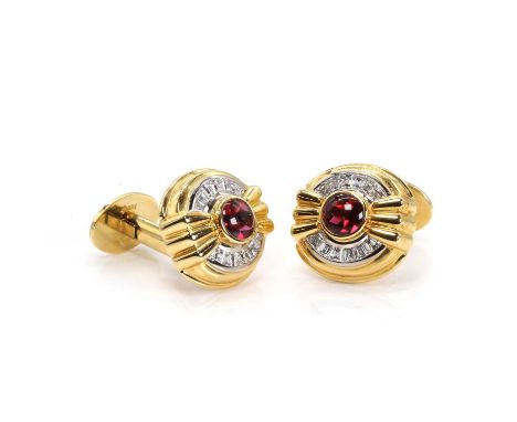 A pair of 18ct gold garnet and diamond cufflinks, by Asprey. each with a central gold reeded bow bezel set with a round garne