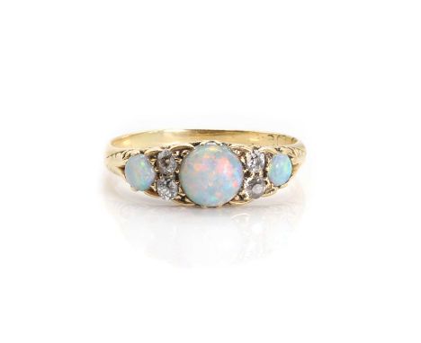 An antique opal and diamond ring,  with vari-sized round opal cabochons, each alternating to a double row of old cut diamonds