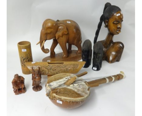 Collection of various carved African and other wood wares including large elephant (converted as a lamp), a tribal guitar, bo