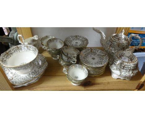 A 19th Century gilt patterned tea service, marked 'GFB Fibre'.