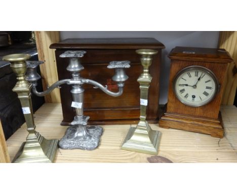 A Victorian oak cased mantle clock, a mahogany cased medicine cabinet, a pair of 19th century brass candlesticks and a silver