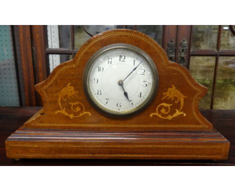 A small French mantle clock with inlaid mahogany case.