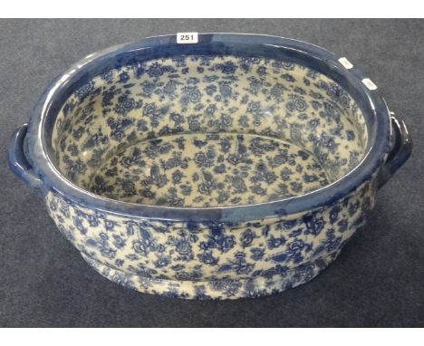 A reproduction Victorian blue and white footbath or planter, width 44cm.