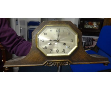 An oak cased mantle clock circa 1920, retailers Page, Keen &amp; Page.