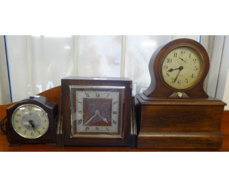 Three electric vintage wall clocks (one has alarm and light).