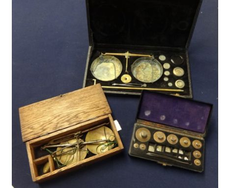 Three boxed opium type scales.