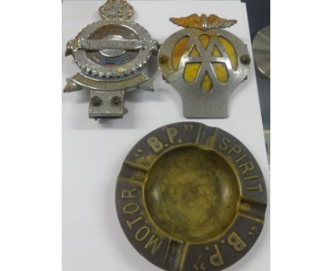 Various car badges and mascots including BP Motor Spirit, Tecalemit Motoring Club, early AA and RAC badges.