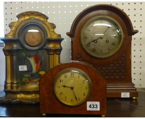 A burr walnut cased mantel clock by Colin Wood, with Swiss movement also a pottery cased clock and an early 20th Century maho