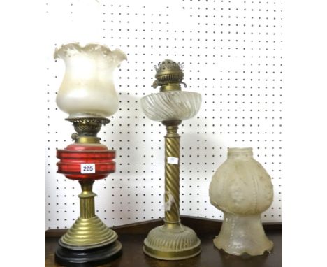 Victorian oil lamp with cranberry glass reservoir with brass base, another Victorian oil lamp with spiral twist brass base, e