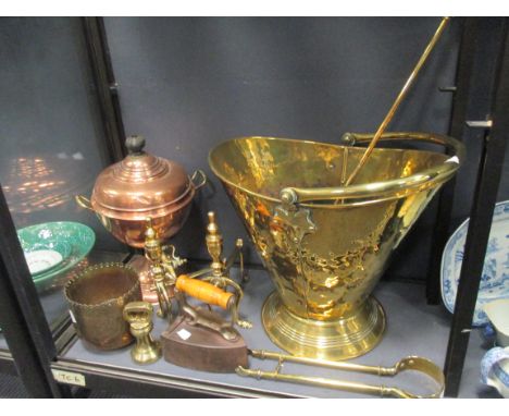 Brassware to include a scuttle, andirons, a charcoal iron, a brass jardiniere and fire tools  