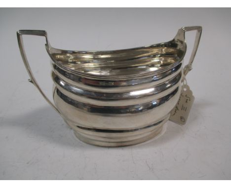 A George III silver sugar basin, maker IB or IP, London 1804, of plain oval shape with two handles, 8.37oz  