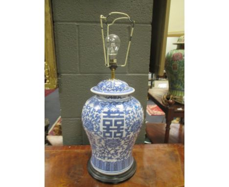 A Chinese blue and white jar as a lamp, 63cm high with shade  