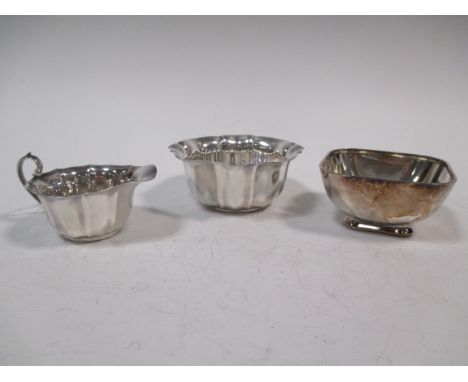 A silver sugar basin by the Atkin Brothers, Sheffield 1905 together with the companion cream jug, 1904 and another plain rect