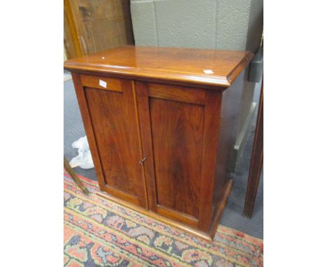 A Victorian rosewood medicine cabinet, two panelled doors enclosing open shelf and two small drawers, 49.5cm wide, 53cm wide 